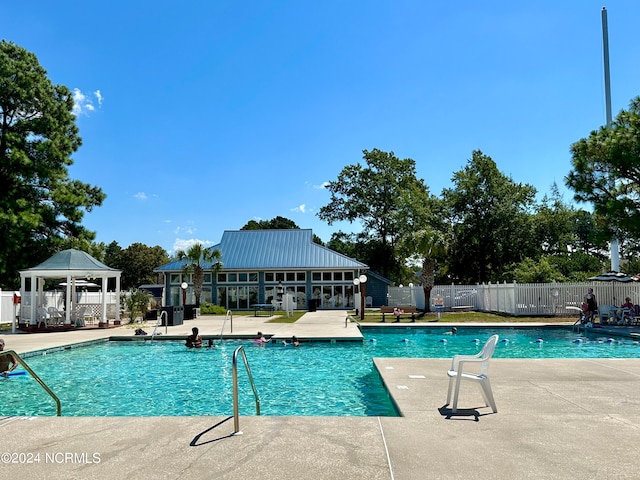 view of swimming pool with a patio area and a gazebo