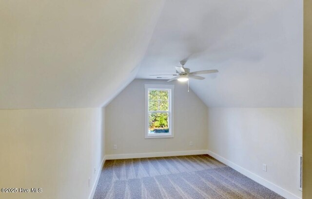 bathroom featuring lofted ceiling, vanity, and toilet