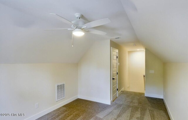 dining space featuring beam ceiling, light wood-type flooring, and a towering ceiling