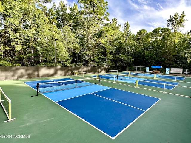 view of tennis court with fence