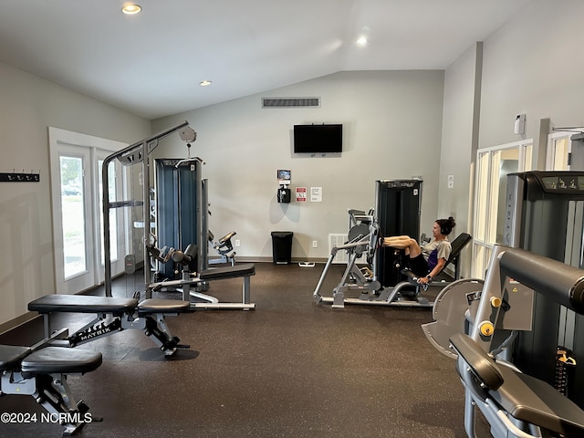 gym featuring vaulted ceiling, recessed lighting, visible vents, and baseboards