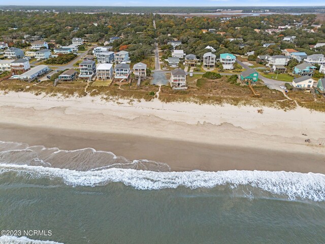 bird's eye view with a view of the beach and a water view