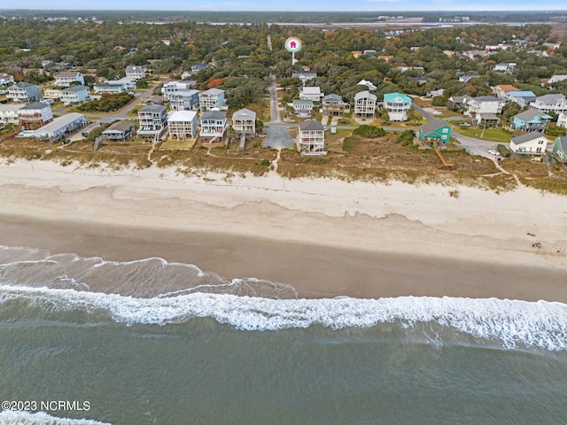 bird's eye view featuring a beach view and a water view