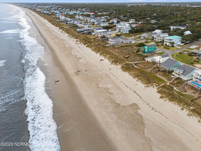 aerial view with a view of the beach and a water view