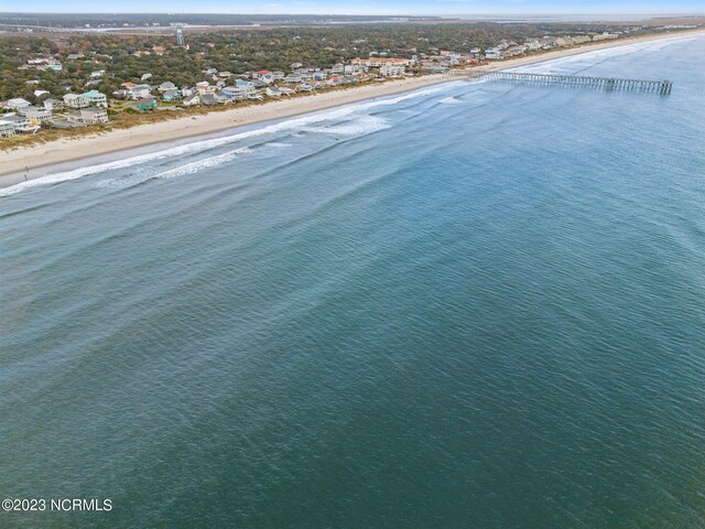 birds eye view of property featuring a view of the beach and a water view