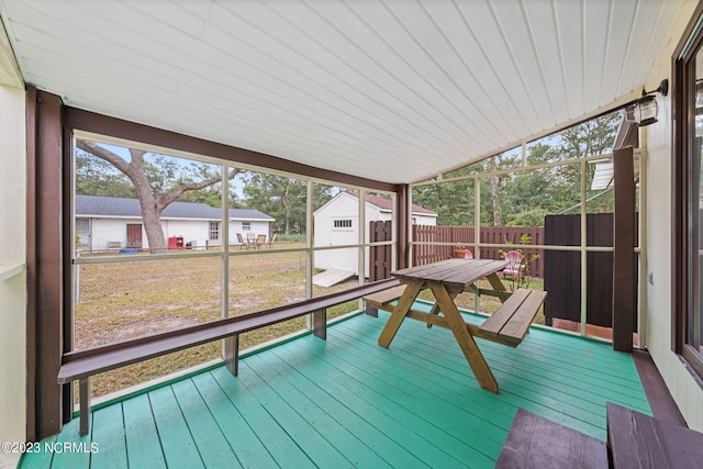 sunroom featuring lofted ceiling