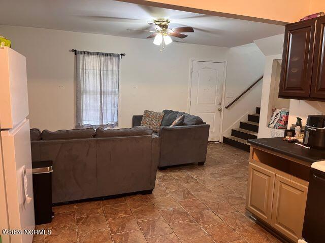 living room featuring ceiling fan