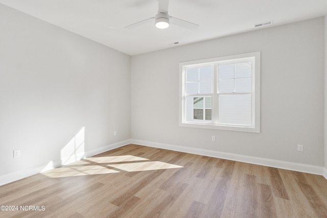 unfurnished room featuring ceiling fan and light hardwood / wood-style flooring