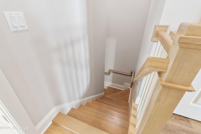 staircase featuring hardwood / wood-style flooring