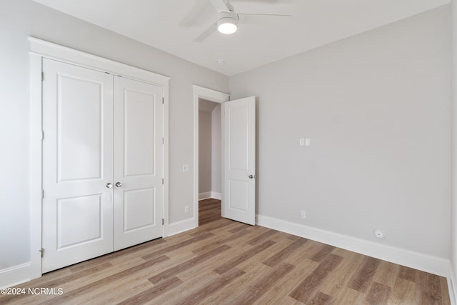 unfurnished bedroom with a closet, ceiling fan, and light hardwood / wood-style flooring