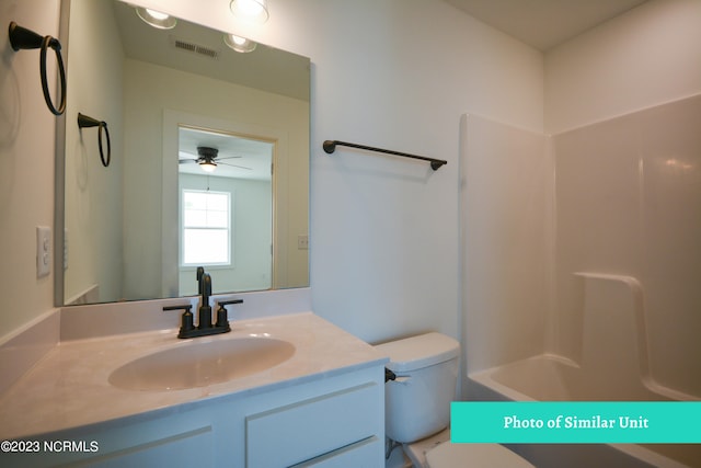 bathroom featuring vanity, toilet, and ceiling fan