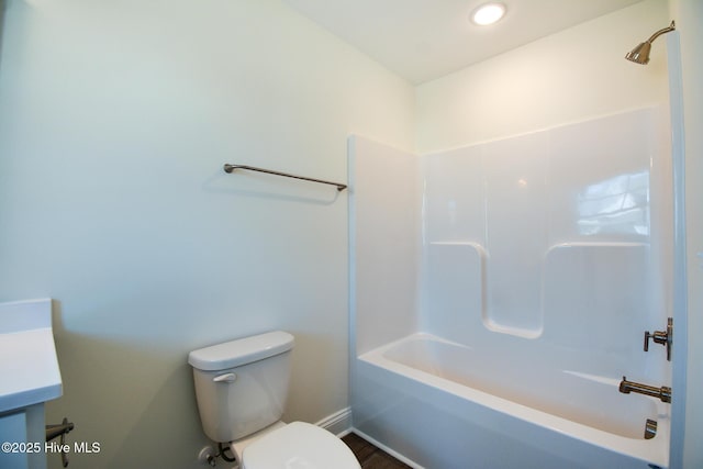 full bathroom featuring shower / tub combination, vanity, and toilet