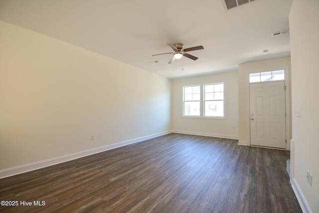 spare room featuring dark hardwood / wood-style flooring and ceiling fan