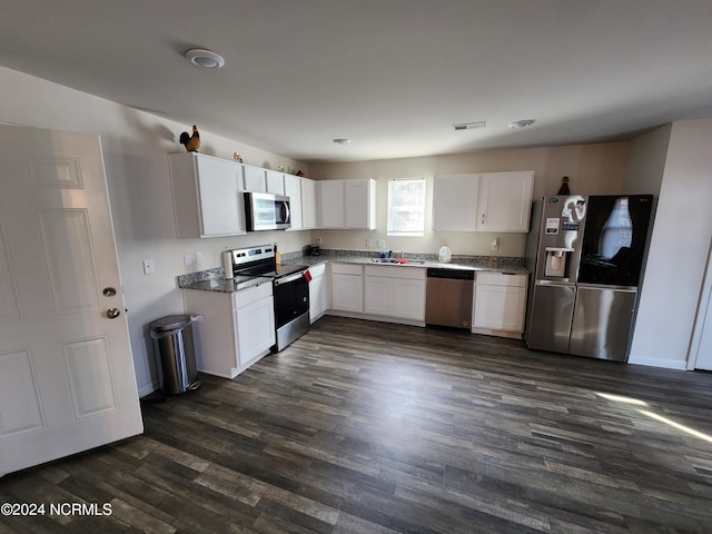 kitchen with stainless steel appliances and white cabinetry