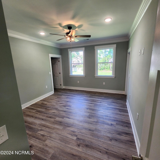 unfurnished bedroom with ceiling fan, ornamental molding, and dark hardwood / wood-style floors