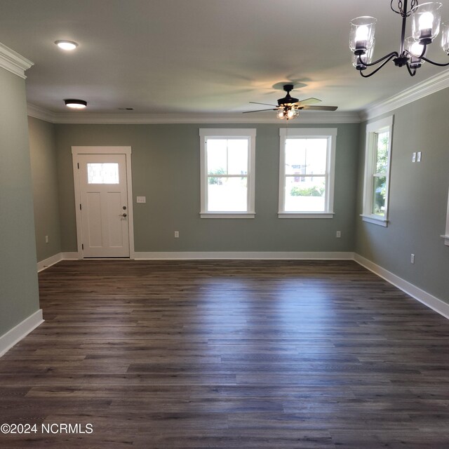 entrance foyer with ceiling fan with notable chandelier, crown molding, and dark hardwood / wood-style flooring