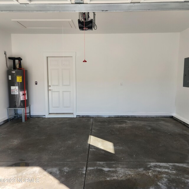 garage featuring a garage door opener, electric panel, and electric water heater