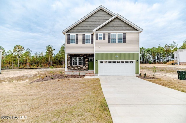 view of front of house with a garage and a front yard