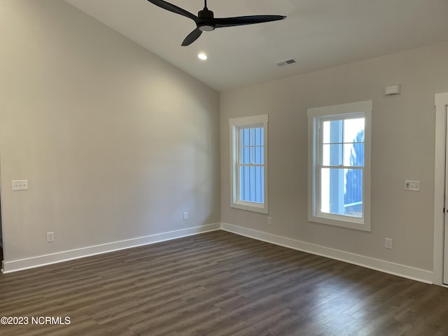 unfurnished room featuring dark wood-style flooring and baseboards