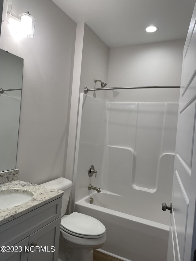 full bathroom with shower / bathing tub combination, vanity, and toilet