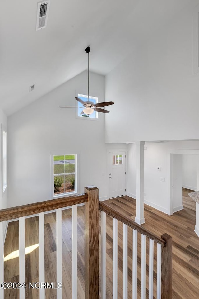 interior space with lofted ceiling and hardwood / wood-style floors