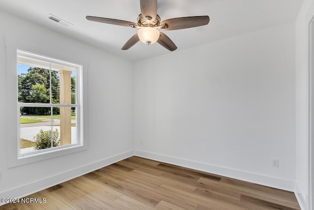 spare room featuring ceiling fan and light wood-type flooring