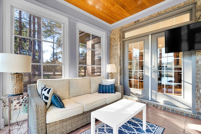 sunroom / solarium with wooden ceiling and french doors