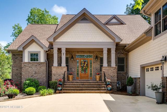 craftsman-style home featuring a garage and a porch