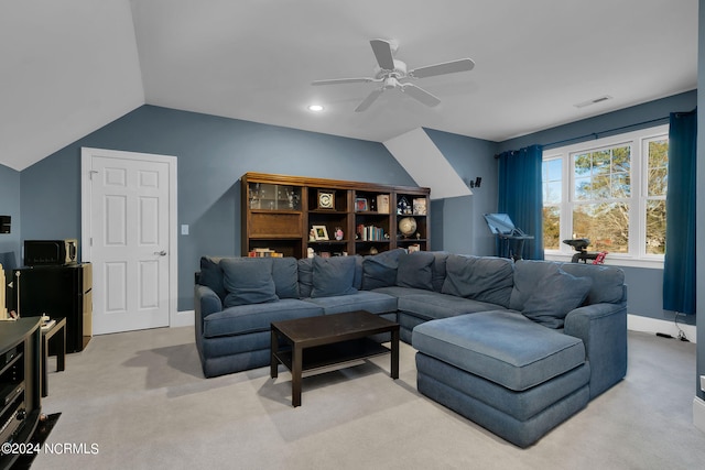 carpeted living room featuring vaulted ceiling and ceiling fan