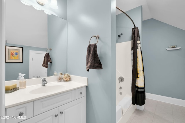 bathroom featuring shower / bath combination with curtain, tile flooring, vanity, and vaulted ceiling