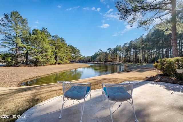 view of patio with a water view