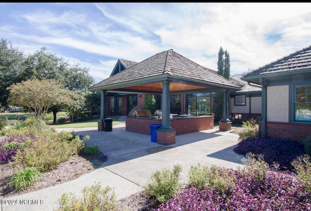 view of property's community featuring a gazebo and area for grilling