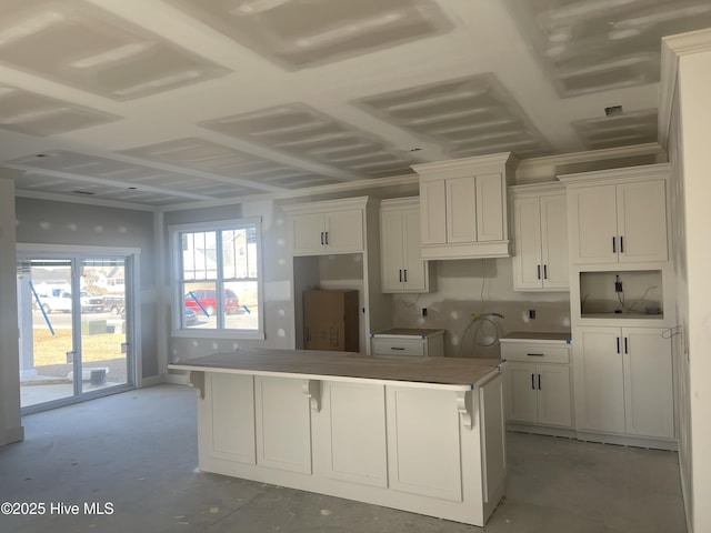 kitchen featuring a kitchen island and white cabinetry