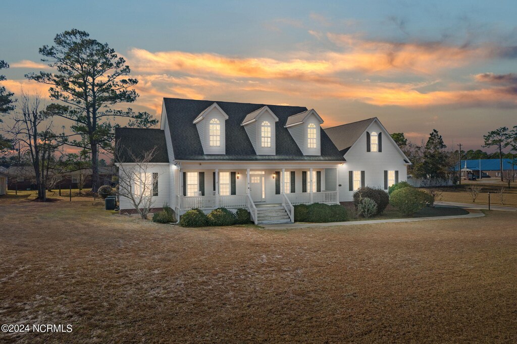 38 Windover Dr, Southport, NC 28461 - view of front of property featuring covered porch