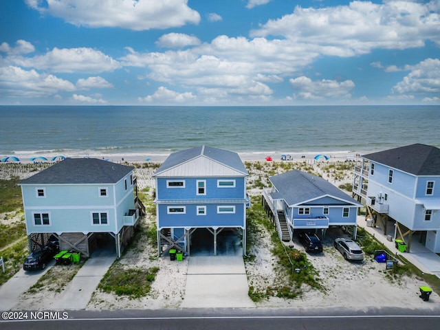 drone / aerial view with a view of the beach and a water view