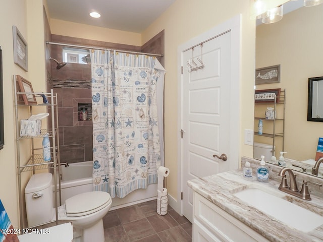 bathroom with shower / tub combo, tile patterned flooring, vanity, and toilet