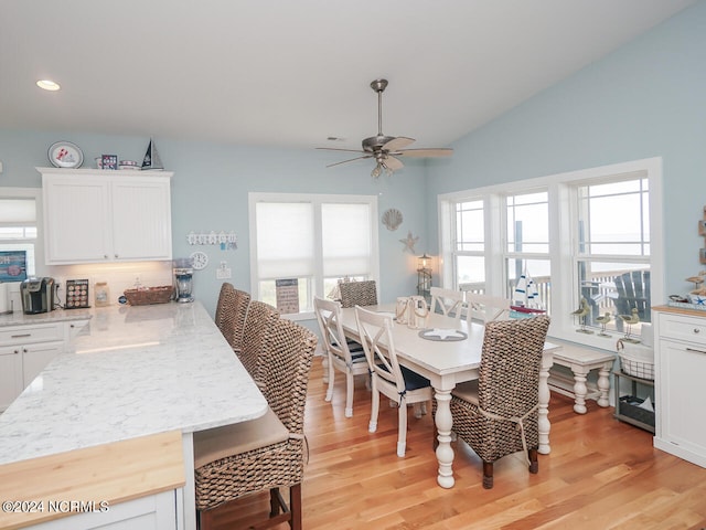 dining space featuring lofted ceiling, ceiling fan, light wood finished floors, and recessed lighting