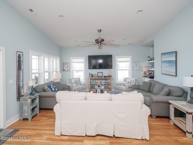 living room featuring visible vents, lofted ceiling, ceiling fan, light wood-type flooring, and recessed lighting