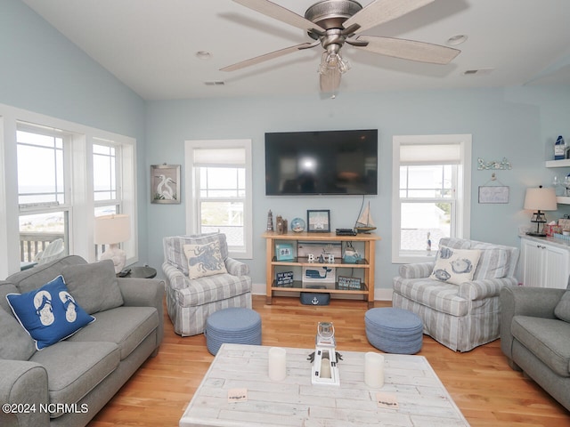 living room with plenty of natural light, wood finished floors, and visible vents