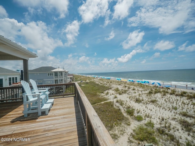 balcony with a view of the beach and a water view