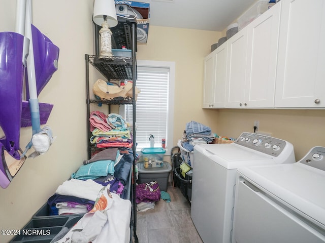 laundry room with cabinet space and washer and dryer