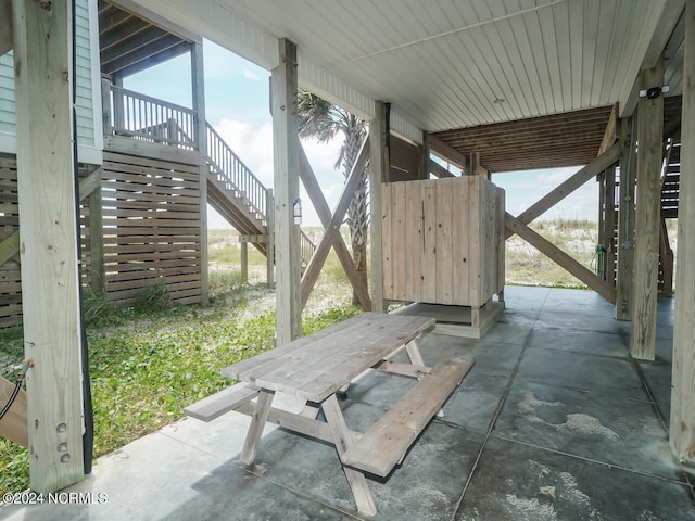 view of patio / terrace featuring stairs