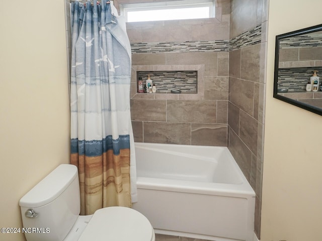 full bathroom with toilet and shower / bathtub combination with curtain