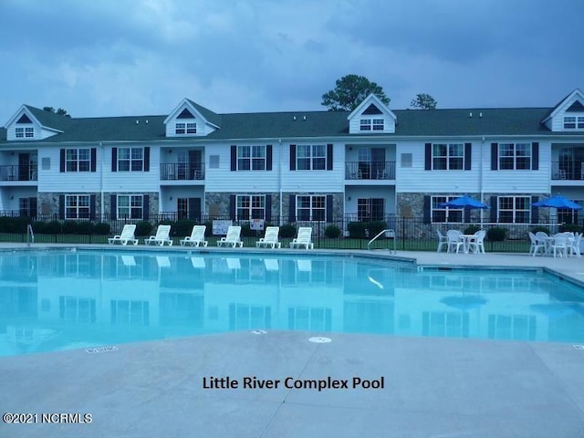 community pool featuring fence