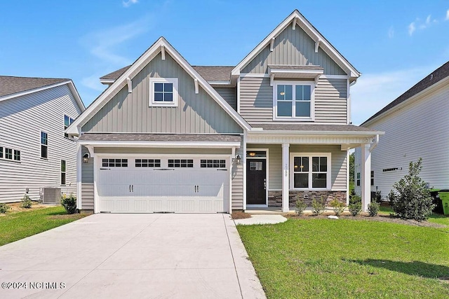 craftsman house with a garage, a front lawn, a porch, and central air condition unit