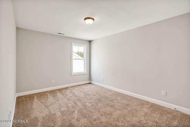 spare room with carpet floors