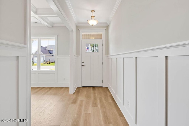 entryway with crown molding, beam ceiling, coffered ceiling, and light hardwood / wood-style floors