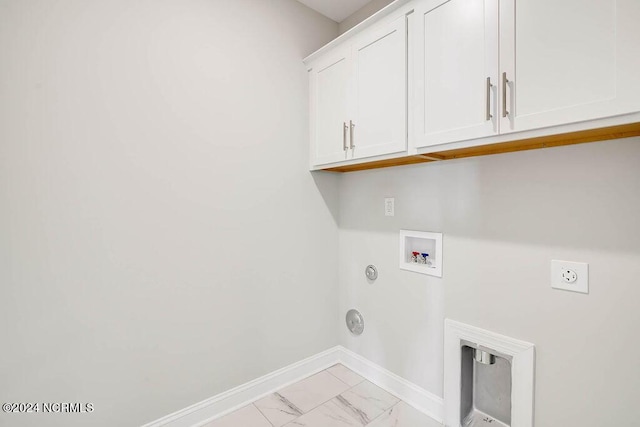 laundry area featuring hookup for a gas dryer, washer hookup, electric dryer hookup, and cabinets