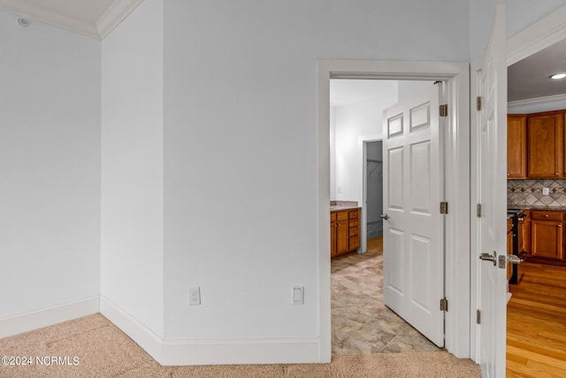 hallway featuring ornamental molding