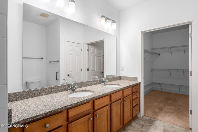 bathroom with toilet and vanity